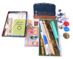 A group of sewing and knitting related items, to include bone knitting needles, wooden needle case,