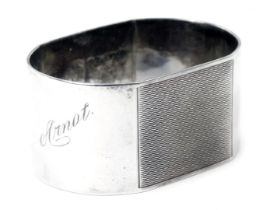 A George VI silver napkin ring, with partial engine engraved decoration and engraved Arnot, Birmingh