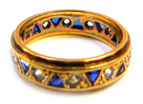 A 9ct gold, sapphire and cz eternity ring, set with round brilliant cut czs and triangle cut sapphir