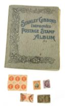 A Stanley Gibbons Improved Postage Stamp Album, containing GB and world stamps for Ceylon, Switzerla