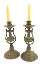 A pair of Victorian brass gimbal ship's wall mounted candle holders, each embossed with scrolls, rep