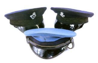 Three peak caps, to include two with reproduction Prison Service caps, with badges. (3)