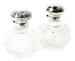 Two silver topped and cut glass dressing table jars, the jars with floral scroll design, Birmingham