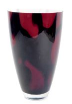 A purple Art Glass Murano style vase, with a white lined interior and black and swirl outer decorati