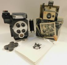 A Polaroid M403R and a Polaroid Swinger EE camera, with instruction manuals. (2)