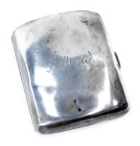 An Edward VII silver cigarette case, of curved form bearing the initials JMW, Birmingham 1913, 2.53o