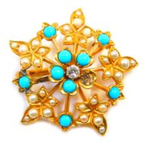 An Edwardian brooch, of circular design set with seed pearls and turquoises, and a central diamond i