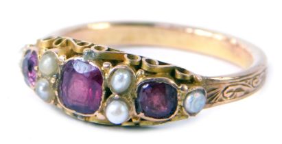 A ruby and seed pearl dress ring, set with square cut garnets and six seed pearls, ring size S, yell