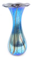 An Alum Bay Isle of Wight blue iridescent glass vase, with a petalated rim, bearing label, 23cm high