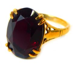 A dress ring, set with oval garnet in four double claw setting, yellow metal stamped 9ct, size L, 2.