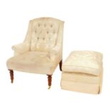 A 20thC armchair, upholstered in cream foliate design fabric with a buttoned back, scroll arms, rais
