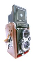 A Yashica Mat dual lens camera, 642516, with f=80mm lens, in leather case.