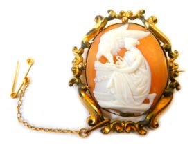 A 19thC shell cameo brooch, the oval cameo depicting maiden and eagle on perch, in a plated scroll f