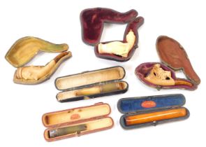 Six pipes, comprising an amber cheroot holder, meerschaum and amber pipe, meerschaum handled partial