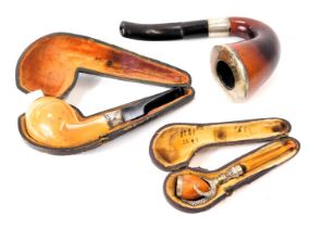 Three pipes, comprising a hand pipe, with silver collar, Birmingham 1910, a fruitwood and silver col