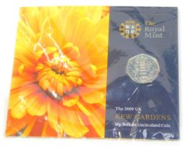 A Royal Mint 2009 Kew Gardens fifty pence brilliant uncirculated coin, in plastic packaging.