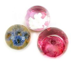 Three glass paperweights, comprising a Caithness Prince and Princess of Wales limited edition number