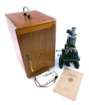 A C. Baker of London cased microscope, model number 2460, in fitted case, 36cm high.