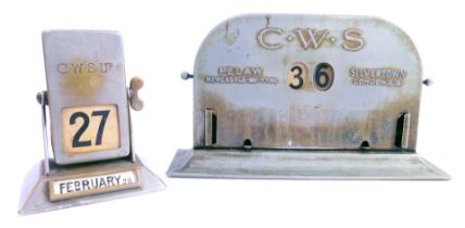 A CWS Pelaw Newcastle on Tyne metal desk calendar, of arched form, on a rectangular outswept base, 1