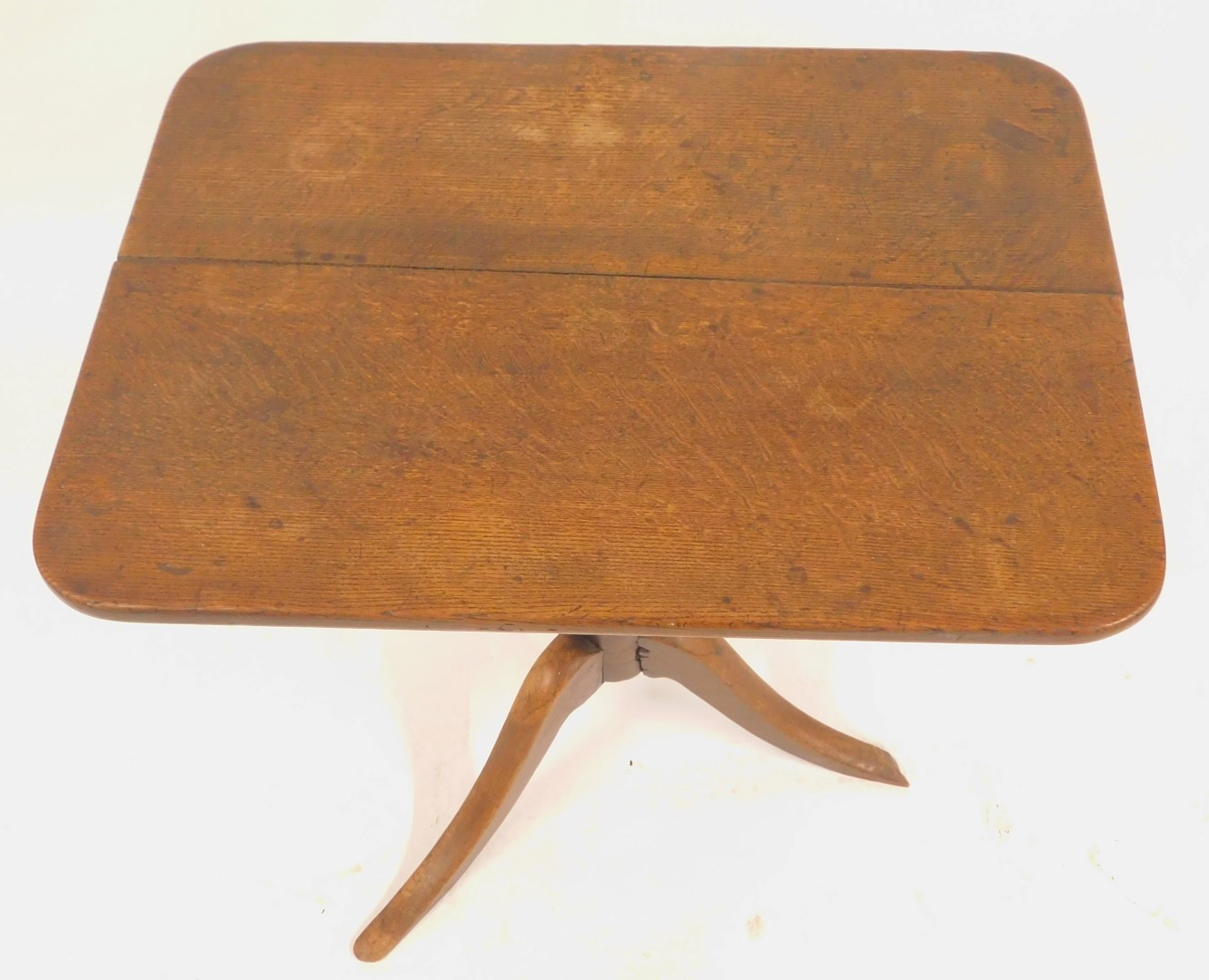A 19thC oak tilt top table, the rectangular top with a rounded edge, on turned column terminating in - Image 2 of 4