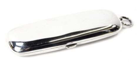A George V silver coin case, with three hinged coin section, of plain outer oval design, Birmingham