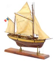 A wooden model of a fishing boat, named The Sainte Marie, La Rochelle 1883 Tunny Boat L24, on an oak