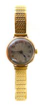 A Rolex 9ct gold cased lady's wristwatch, with a circular silvered numeric dial, in a 9ct gold case,