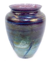 A Caithness iridescent glass vase, in blue and purple design, with swirls, 20cm high.