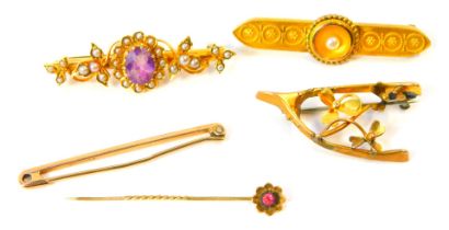 A group of Victorian and later bar brooches, comprising an amethyst and seed pearl floral brooch, ye