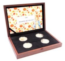 A Peter Rabbit The Four Seasons silver collector's coins set, each enamel decorated for autumn, summ