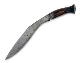 A Nepalese or Indian Kukri, with wooden handle, curved steel blade and brown leather scabbard bearin