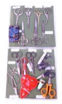 A group of sewing scissors, varying designs to include stork, a buttonhole cutter, cleaper, etc.