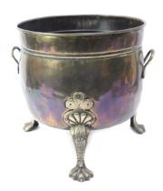 A late Victorian copper and brass two handled log bucket, the copper body of cylindrical form, raise