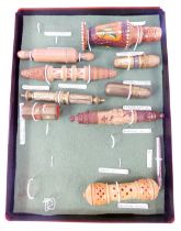 A group of needle cases, to include a wooden example modelled as a rolling pin, carved wooden Austri