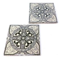 A pair of late 19thC white fronted fireside tiles, with foliate decoration, 15cm x 15cm.