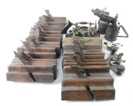 A Stanley No 55 moulding plane and others, including a quantity of beech moulding planes, blow lamps