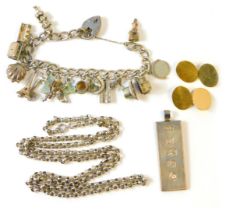 A group of silver and other wares, comprising a silver ingot pendant, silver charm bracelet with ass