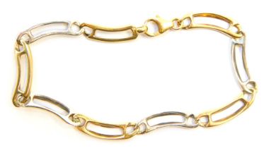 A bracelet, of bicolour arched form, with pierced and shaped links, yellow metal stamped 375, 18cm l