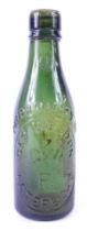 A Geo Weldon of Peterborough glass bottle, no.1744,21cm high.