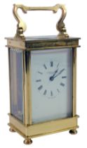 J Hawton and Son of London. 20thC brass cased anniversary clock, with swing handle, white enamel Rom