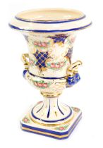 A Jafferose Italian pottery campana vase, decorated with roses, gilt heightened cobalt blue hatching