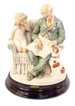 A Florence by Giuseppe Armani figure group, modelled as Granddad with little girl, on hardwood base,