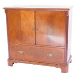A 20thC mahogany television cabinet, the rectangular top with a moulded edge with cross banding, wit