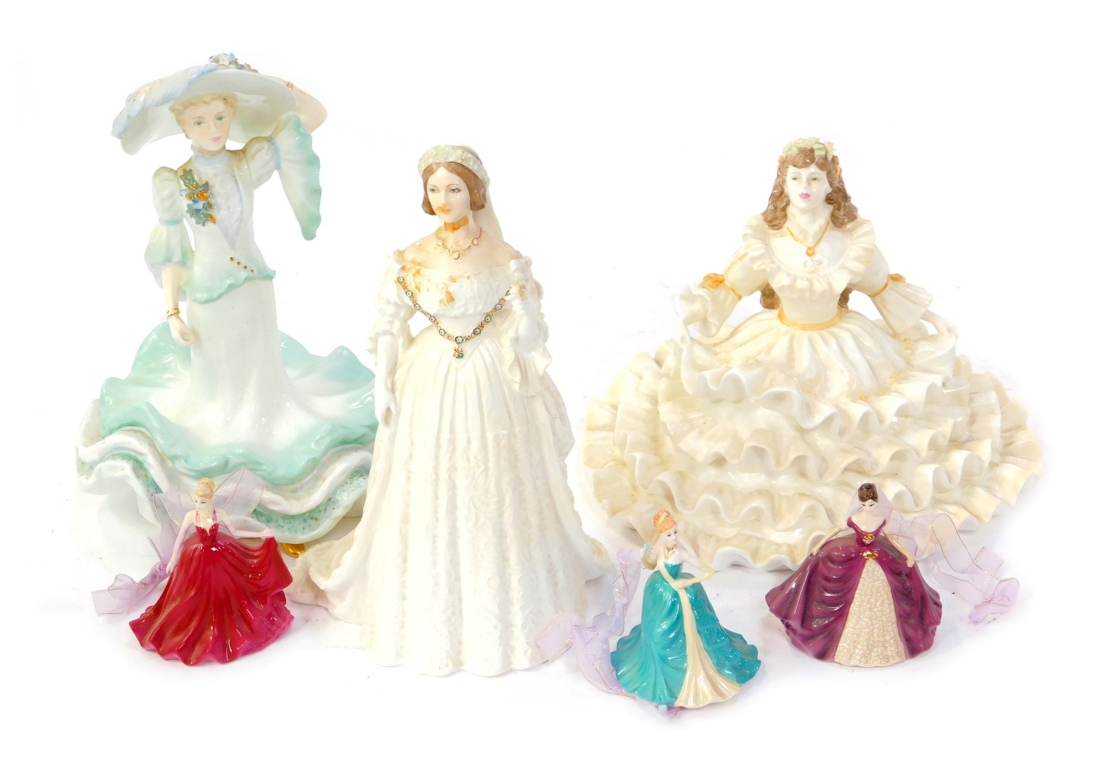 Three Coalport porcelain figures, comprising Ladies of Fashion, 19cm high, Queen Victoria, limited e