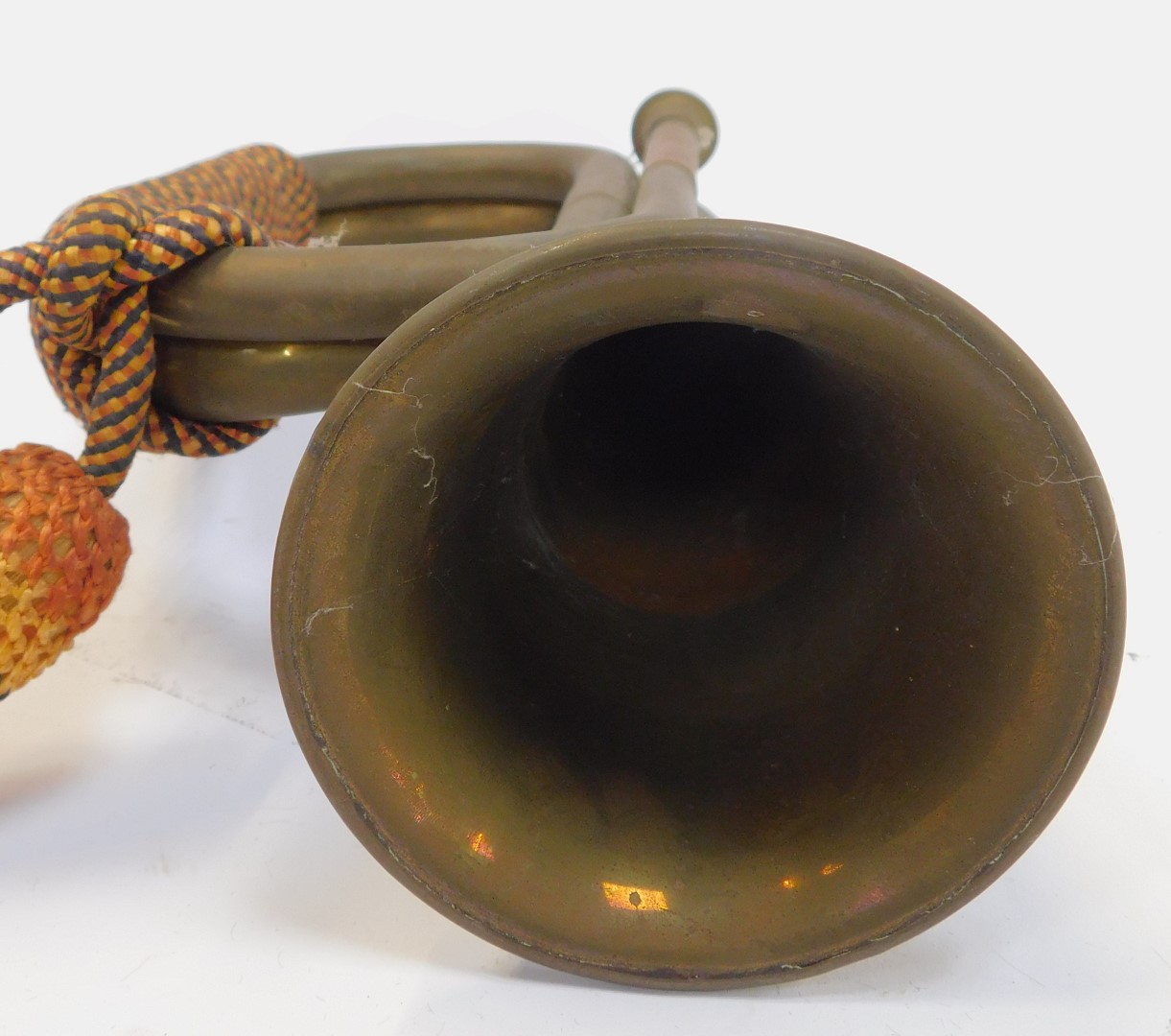 A copper and brass bugle, with orange, yellow and blue rope work frogging, 29cm long. - Image 2 of 3