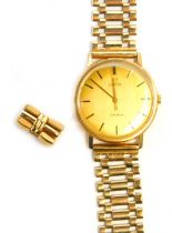 An Omega gentleman's 9ct gold wristwatch, with a gold finish baton dial, 3cm wide, on a two bar brac