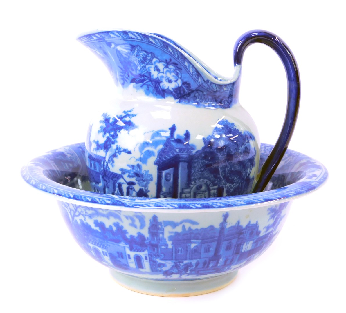 An ironstone blue and white wash jug and bowl set, comprising jug depicting buildings, 21cm high, an