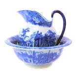 An ironstone blue and white wash jug and bowl set, comprising jug depicting buildings, 21cm high, an