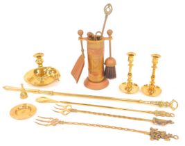A group of brassware, to include fireside implements, poker, toasting fork, candlesticks, chambersti