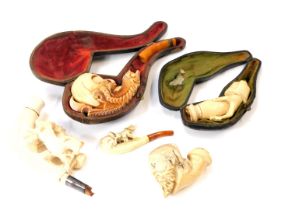 A group of meerschaum type pipe and pipe parts, comprising short handled, long handled, two in fitte